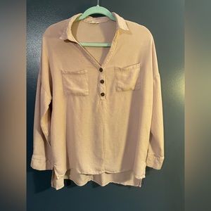 Long sleeved dusty pink shirt with wooden buttons
